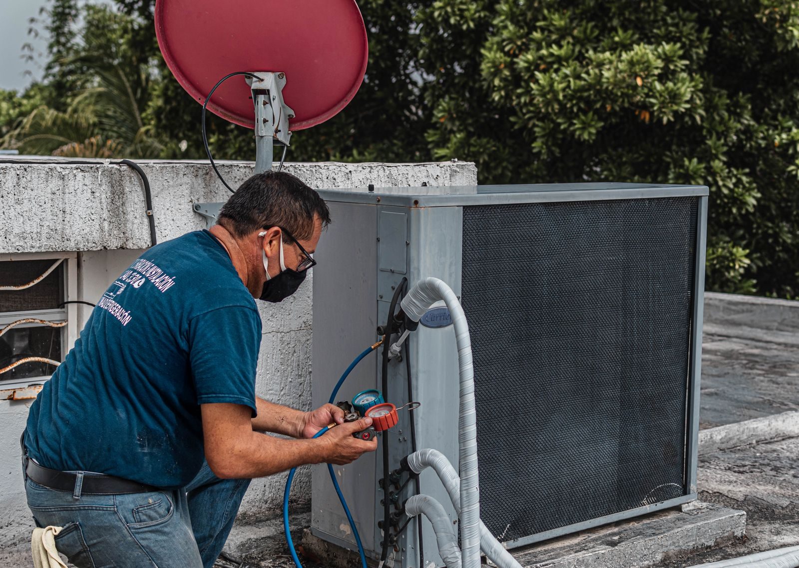 Just Vents technician servicing a home HVAC system